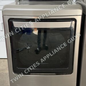 Graphite steel LG electric dryer, front view with the glass door and rear control panel