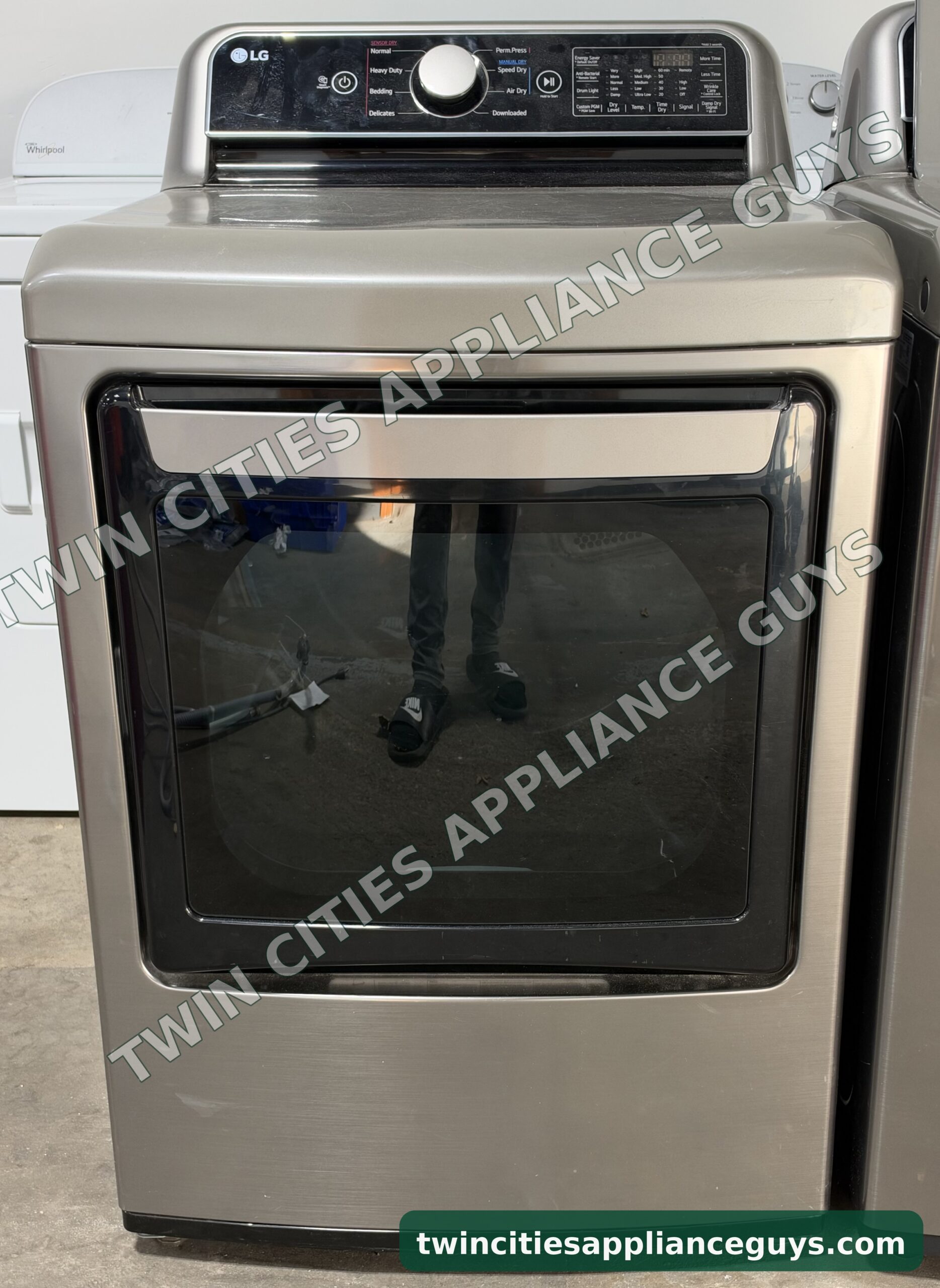 Graphite steel LG electric dryer, front view with the glass door and rear control panel