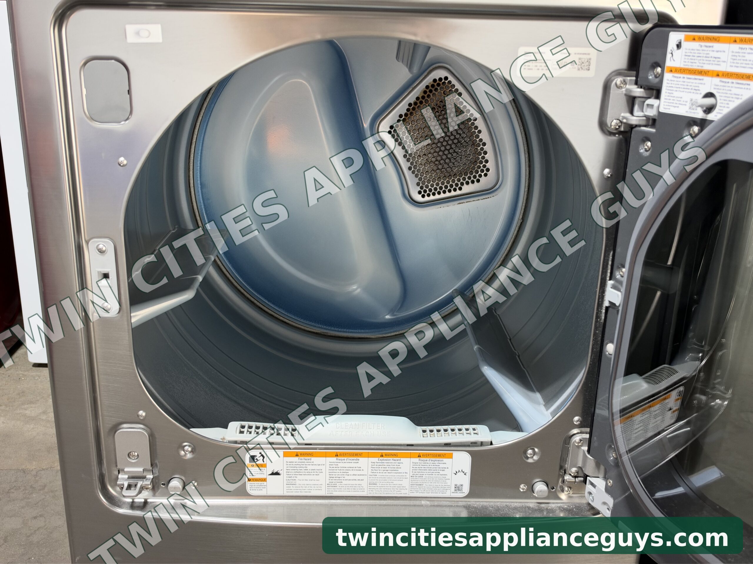 LG electric dryer with the door open showing the drum interior
