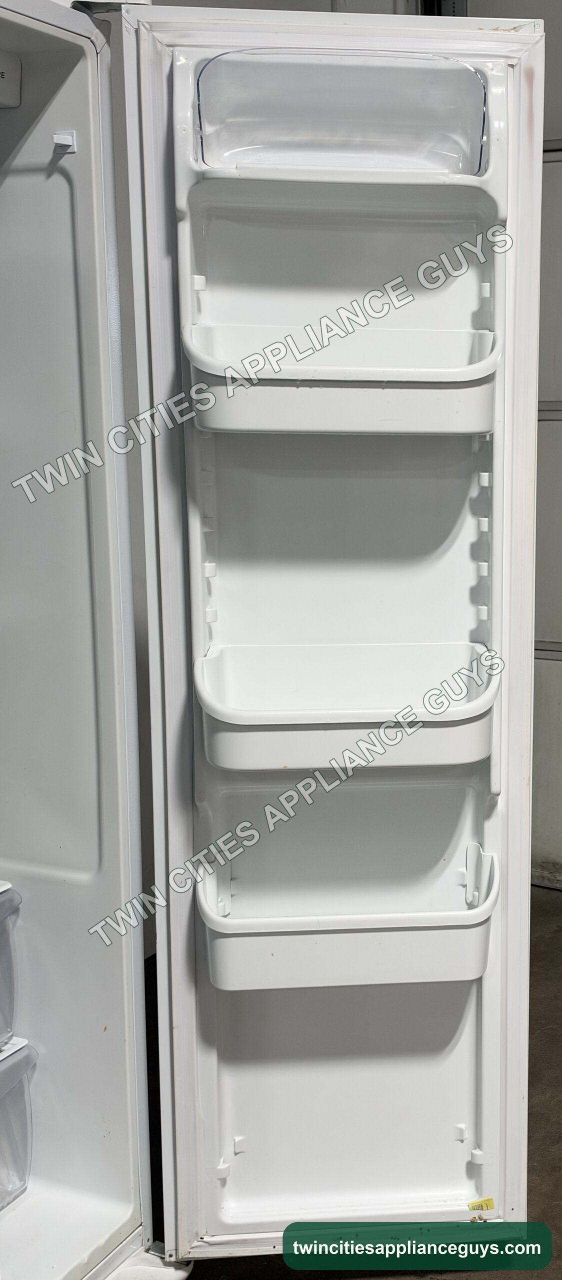 Frigidaire side-by-side refrigerator fresh food door showing the door bins