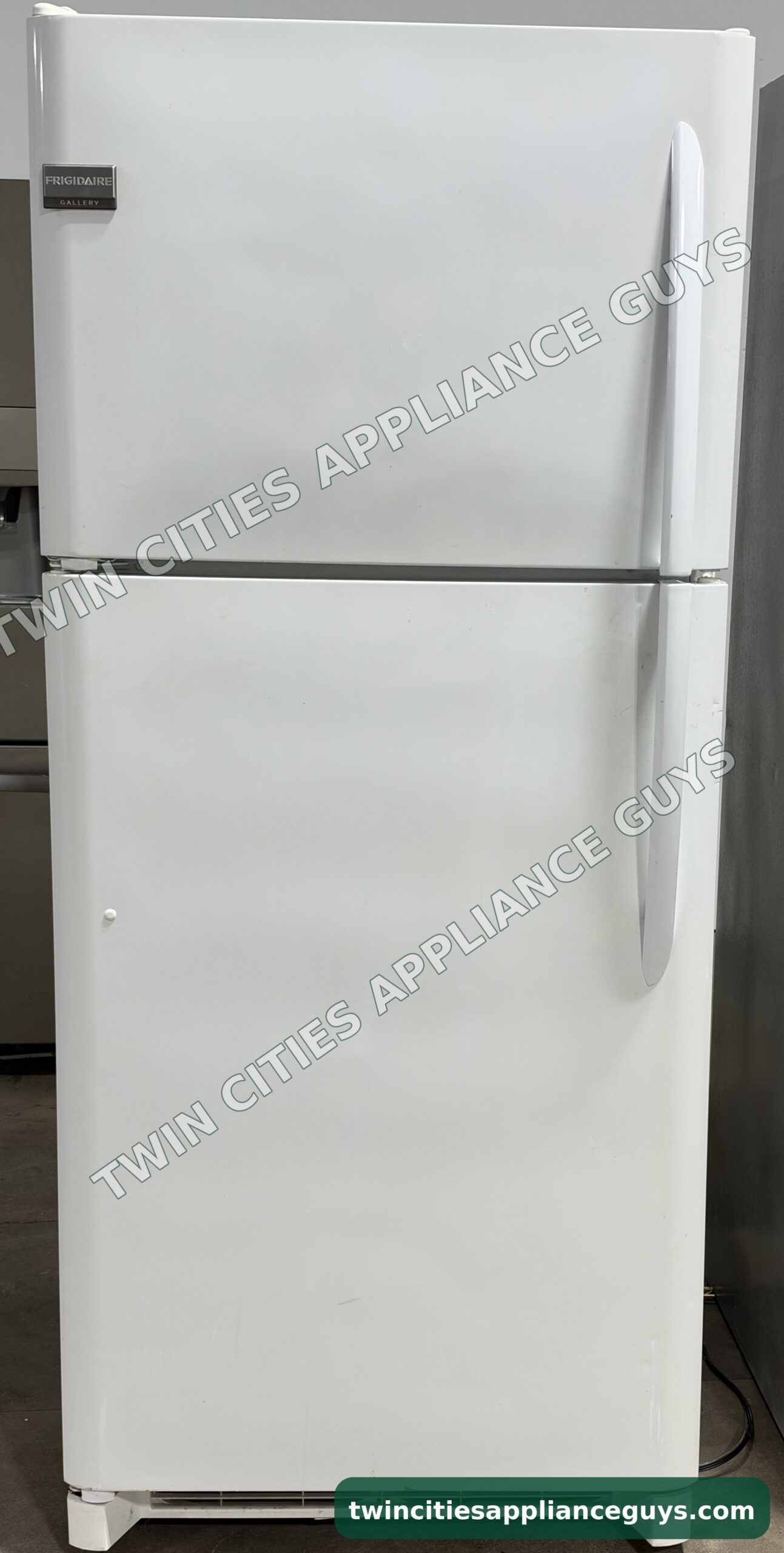 White Frigidaire Gallery top-freezer refrigerator, front view with both doors closed