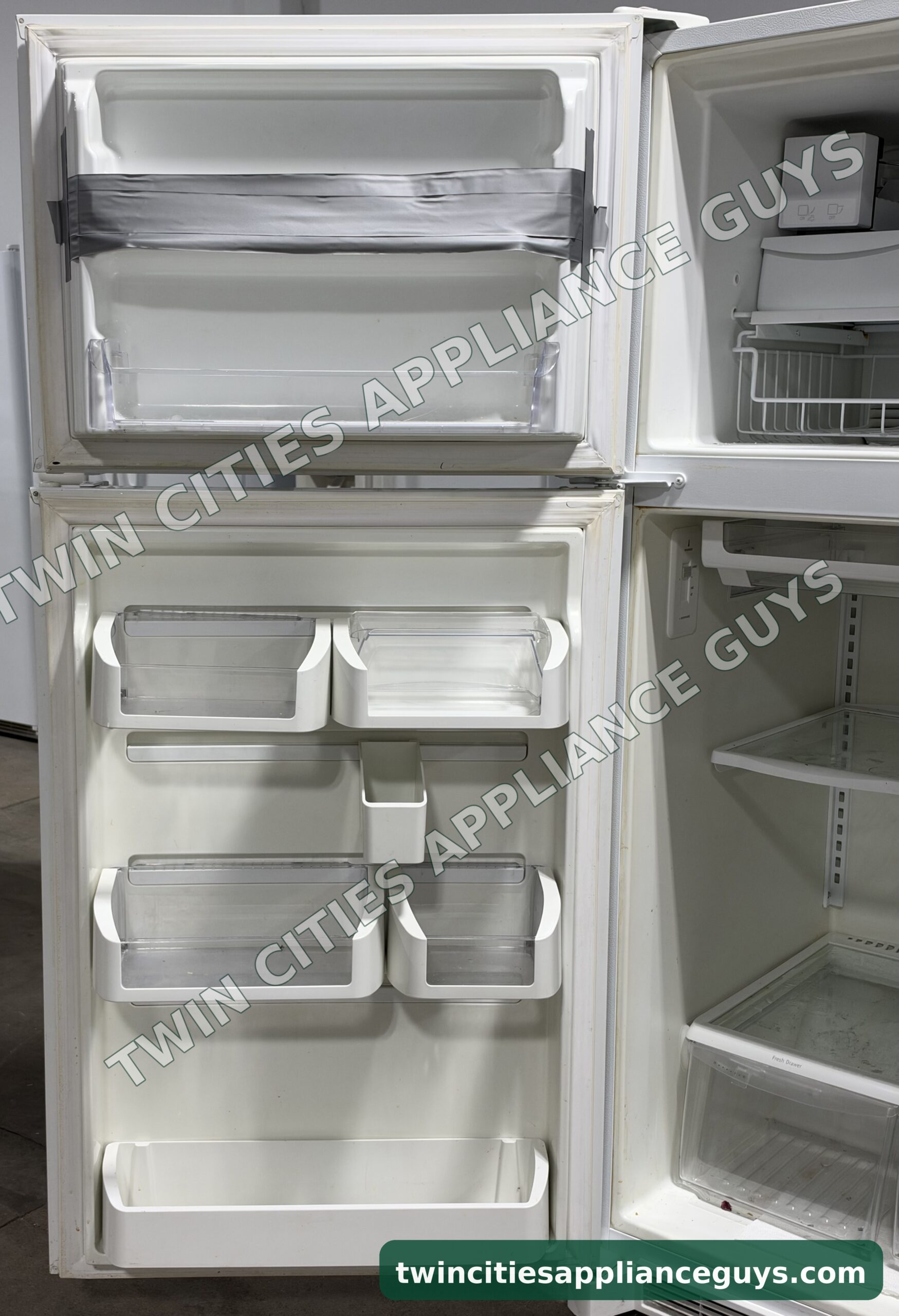 Frigidaire Gallery refrigerator door bins on the open freezer and fresh food doors