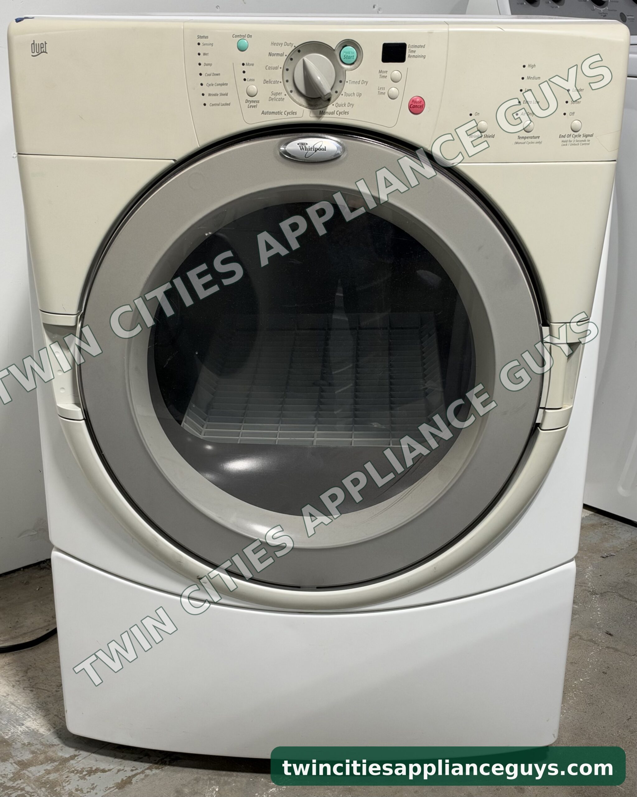 Whirlpool Duet front-load gas dryer, front view with the round glass door closed
