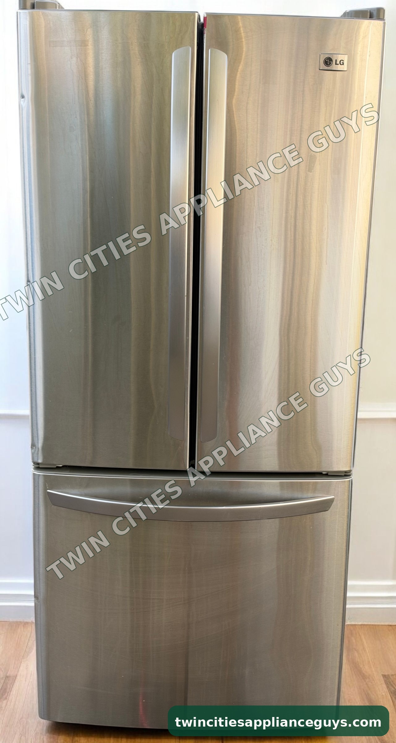 LG stainless steel French door refrigerator front view with doors closed