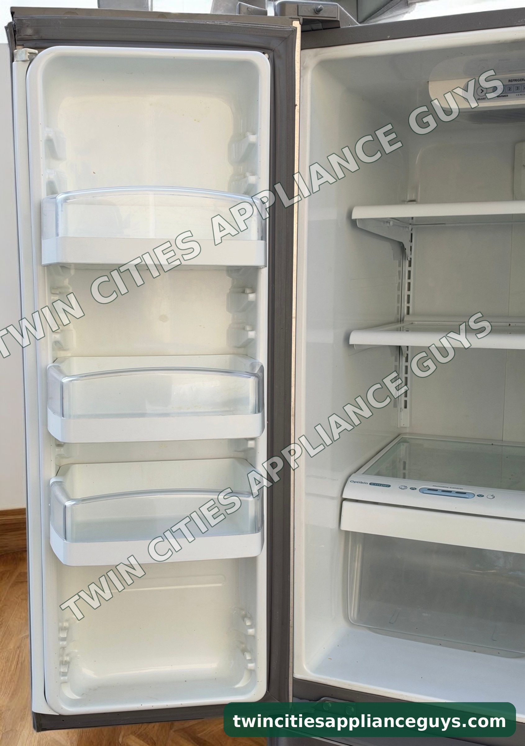 LG refrigerator left door open showing door bins and fresh food shelves