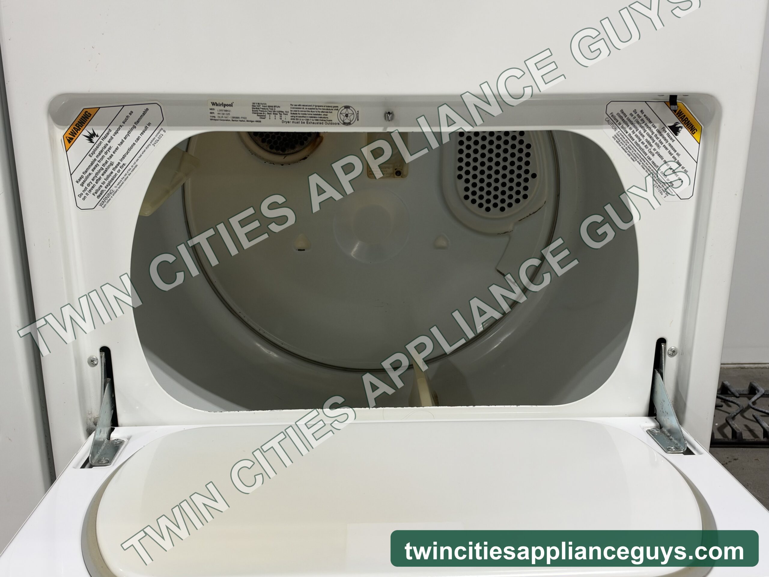 Whirlpool dryer with the door open showing the drum