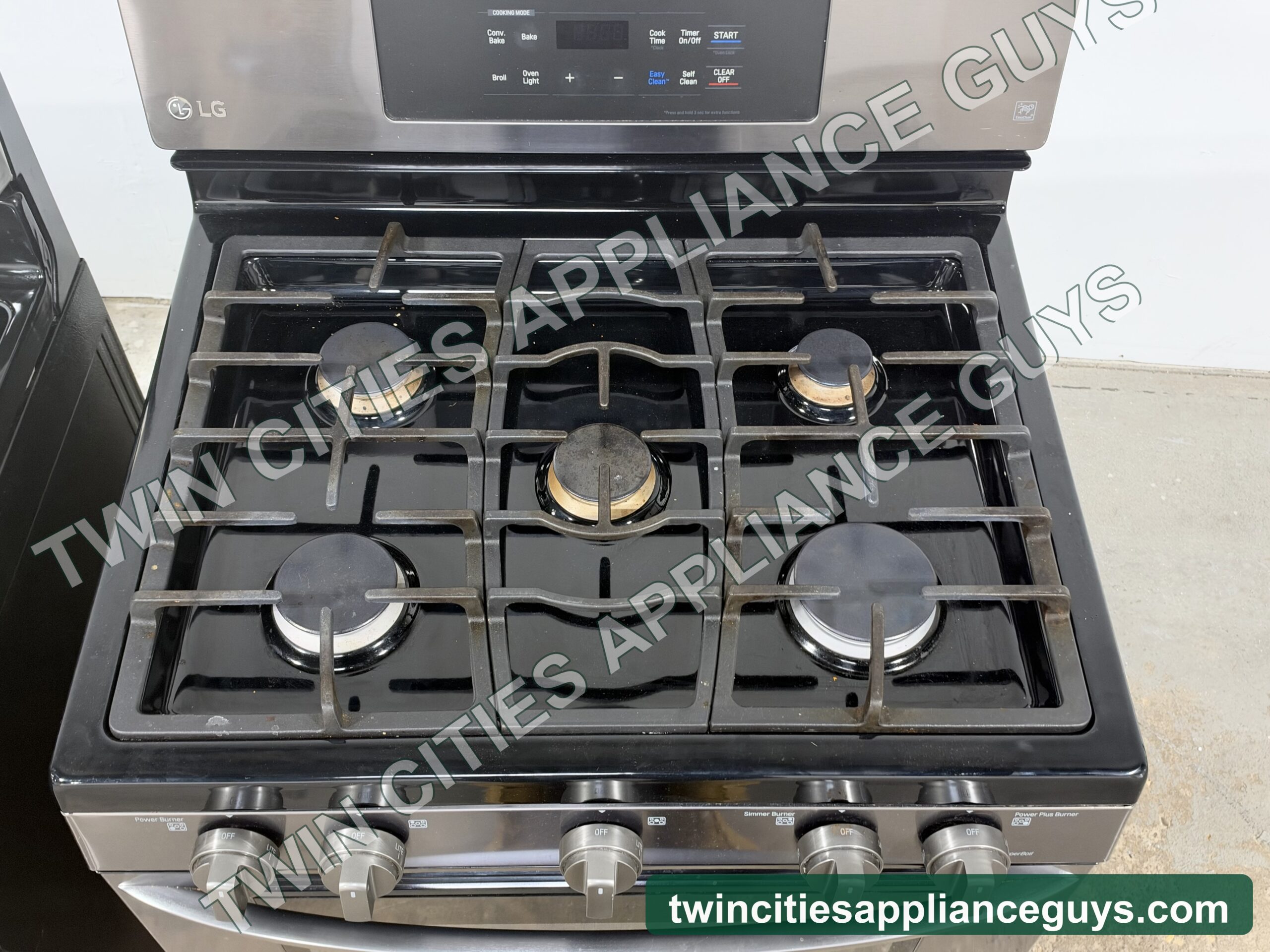 LG gas range cooktop seen from above showing five sealed burners and grates