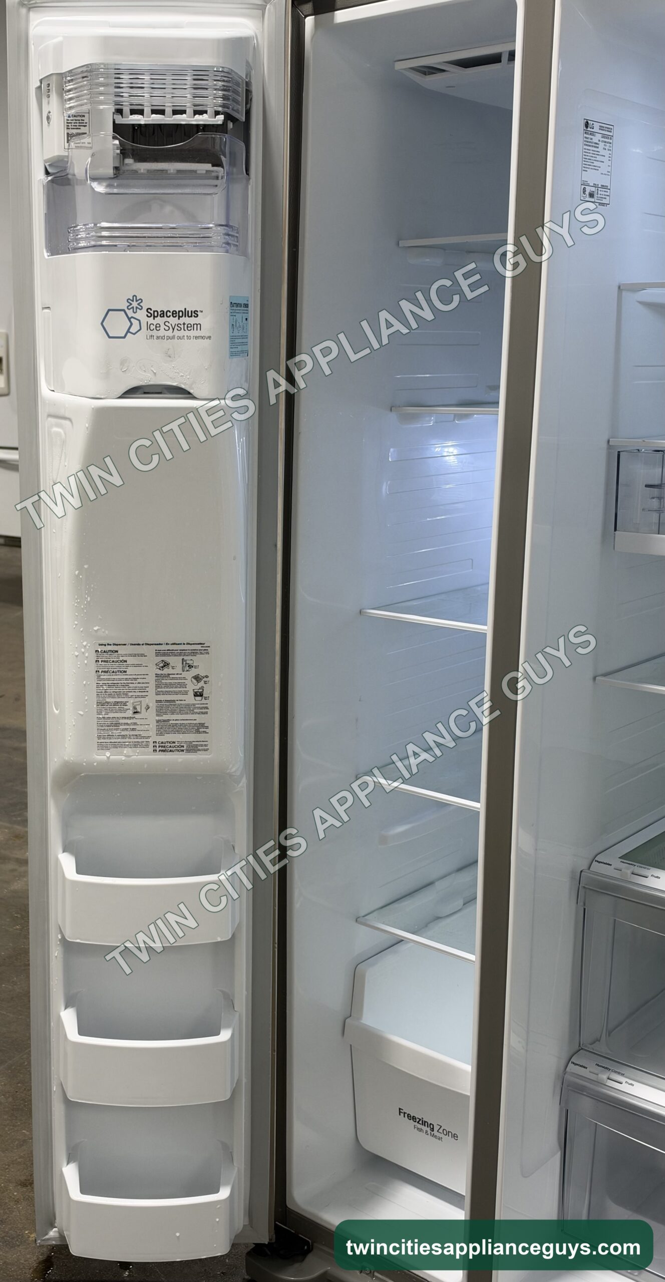 LG freezer door open showing the in-door ice system and door bins