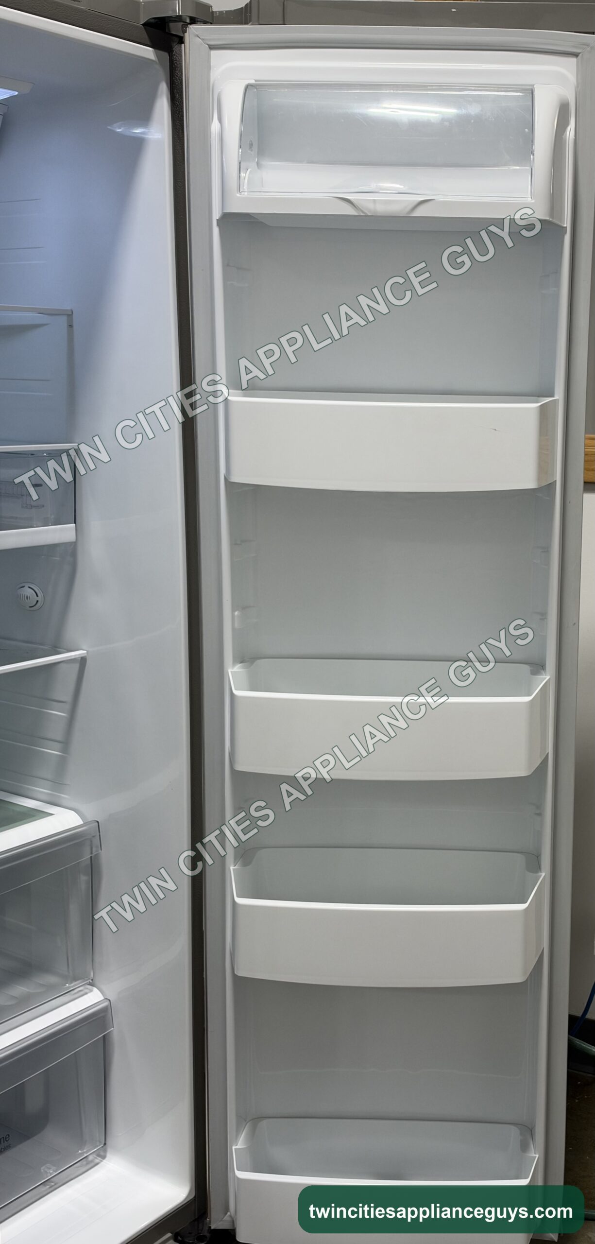 LG refrigerator door open showing adjustable door bins