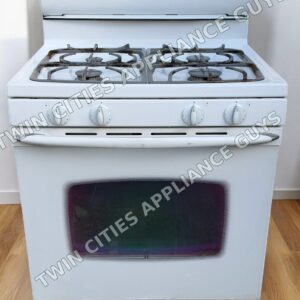White Maytag gas range front view with four burner grates and oven door closed