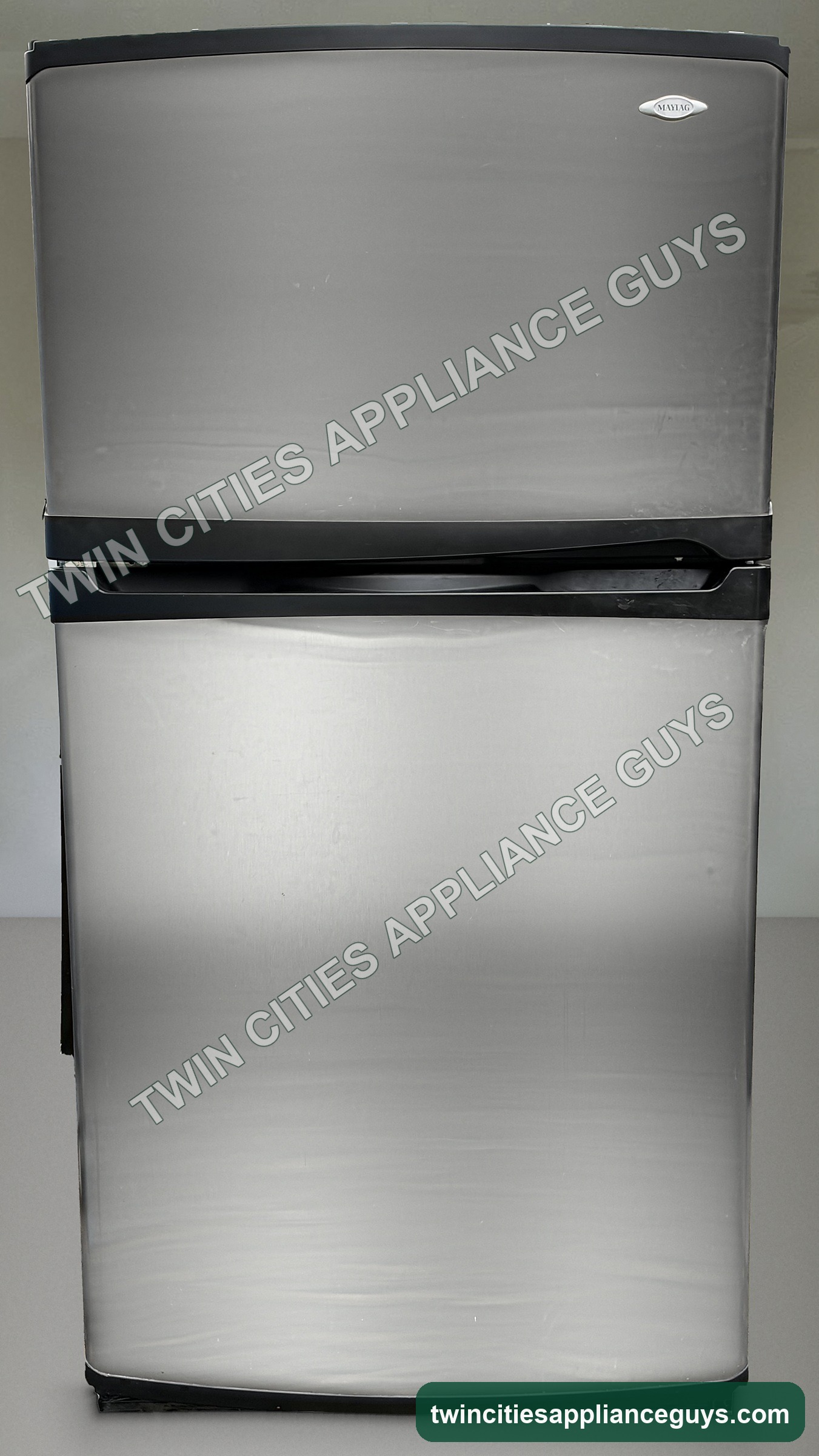 Maytag stainless top-freezer refrigerator front view with doors closed
