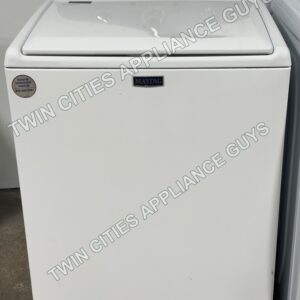 White Maytag top-load washer front view with the lid closed and control panel