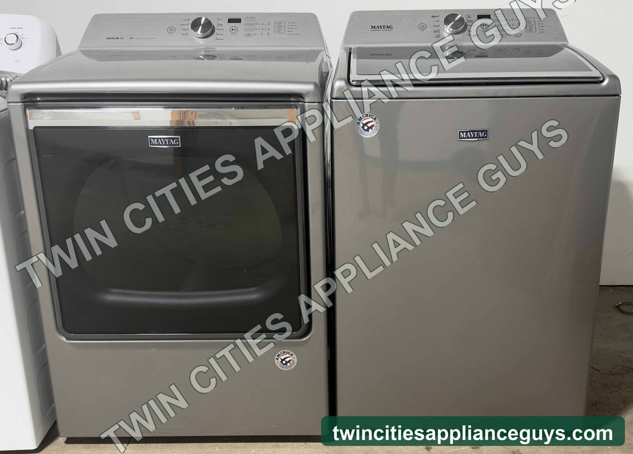 Metallic slate Maytag gas dryer and top-load washer side by side, front view
