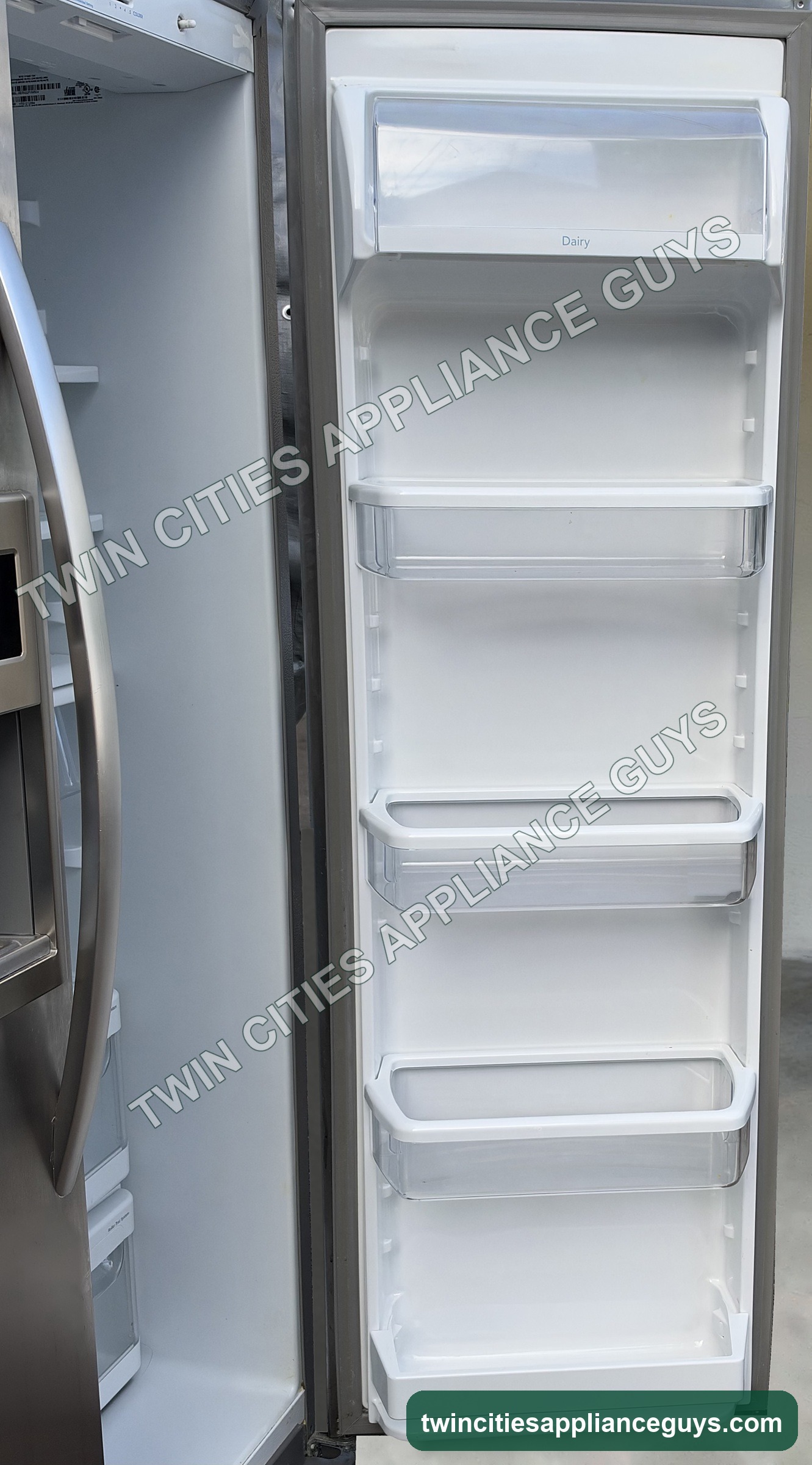 KitchenAid side-by-side refrigerator fresh food door open showing door bins and dairy compartment