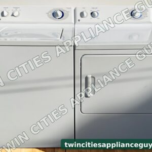 White GE top-load washer and electric dryer side by side, front view