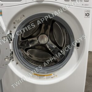 LG front-load washer with the door open showing the stainless wash drum