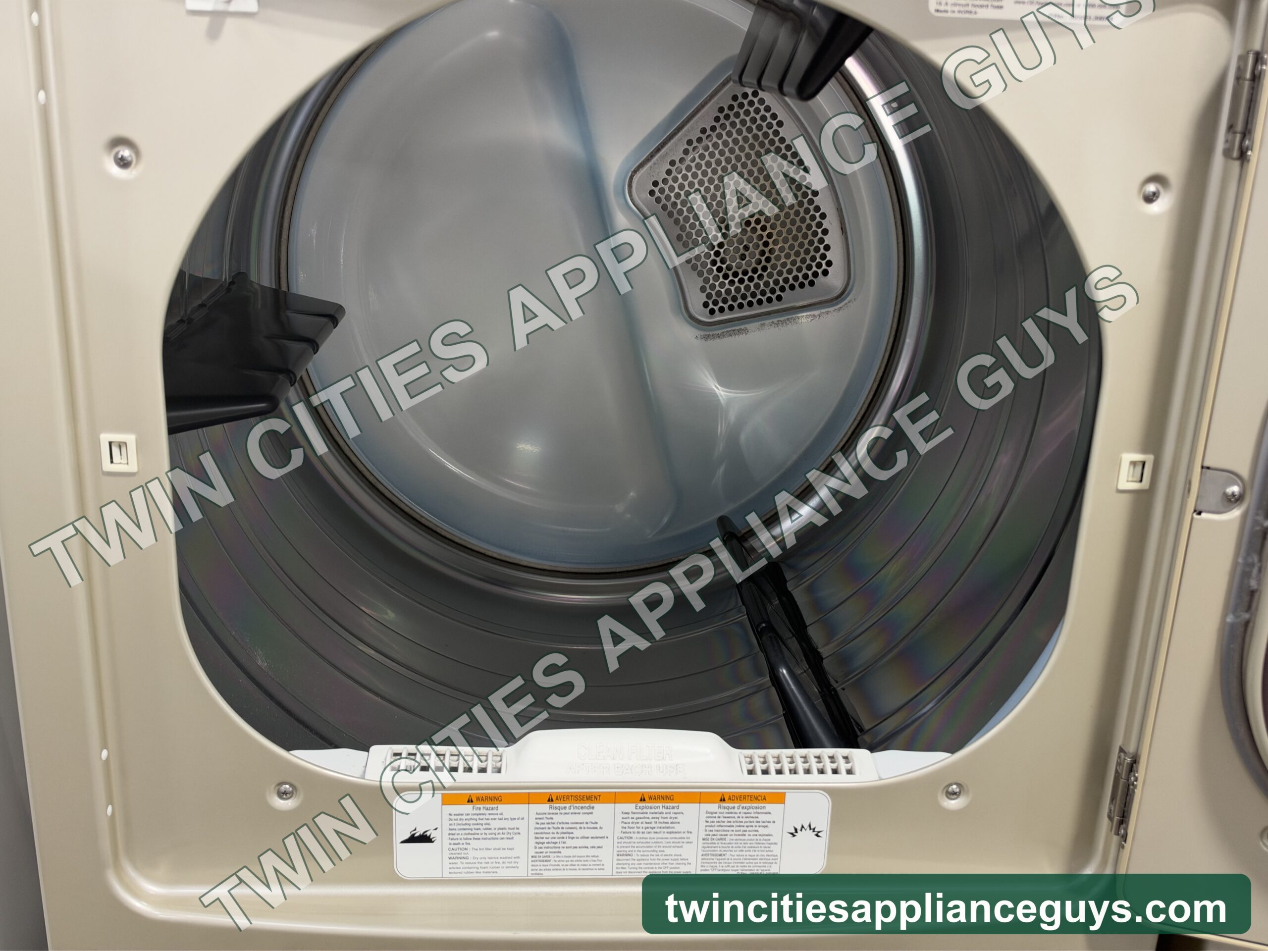 GE Profile electric dryer with the door open showing the drum