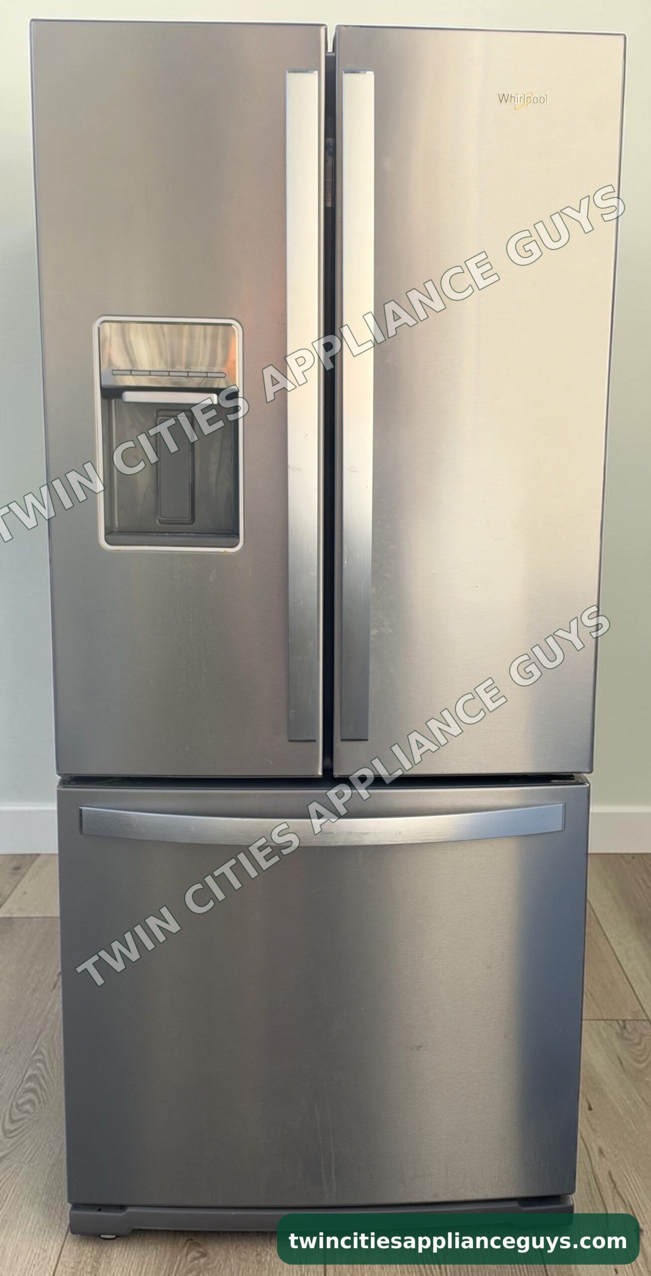 Whirlpool stainless steel French door refrigerator front view with doors closed